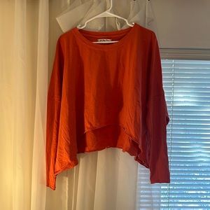 NWT Free People We The Free Oversized LS Crop. Size Medium. Poppy color.
